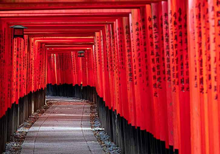 FUSHIMI INARI IN KYOTO COMPRISES SOME 5,000 RED TORI GATES.